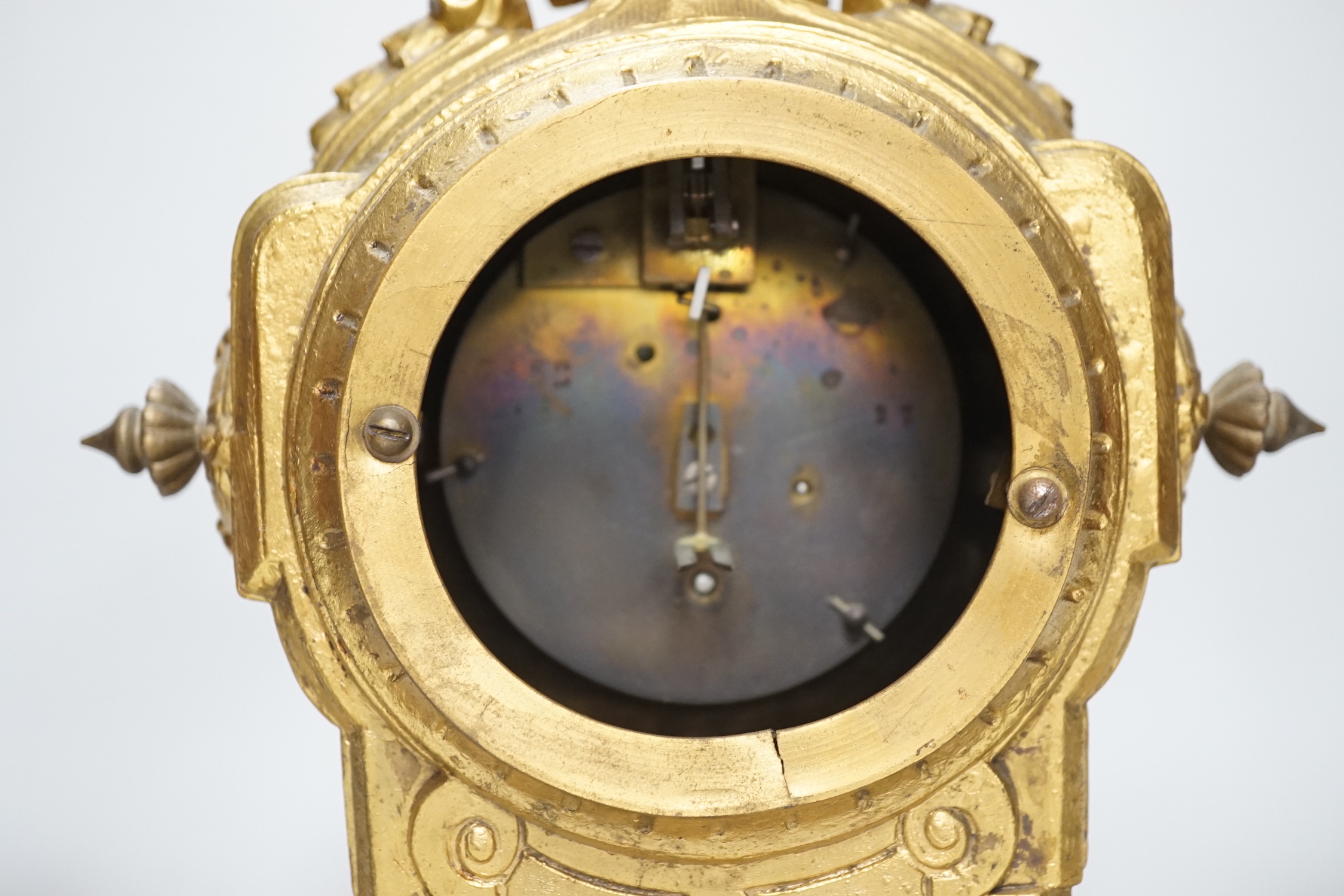 A 19th century porcelain mounted gilt spelter clock garniture, hand painted with landscapes, 30cm high